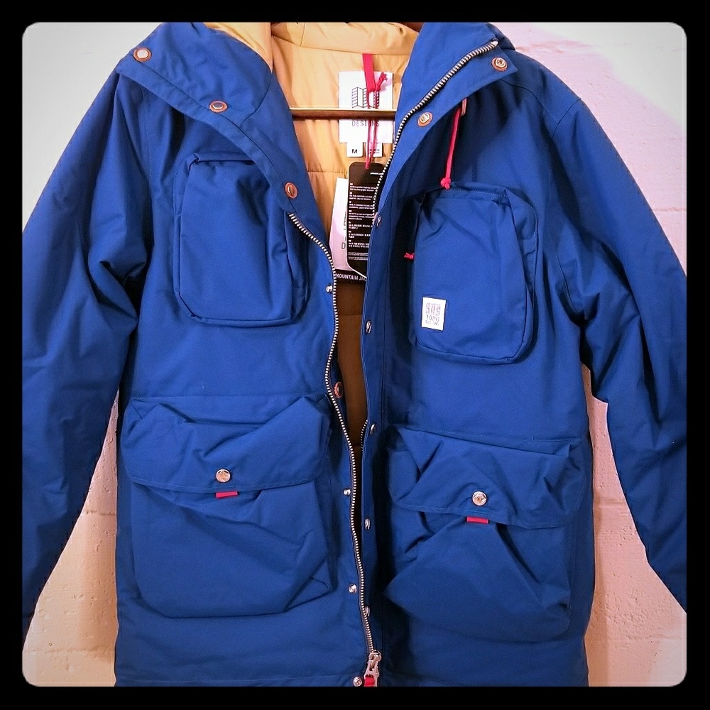 Topo jacket, Brand new. One snap button came off.